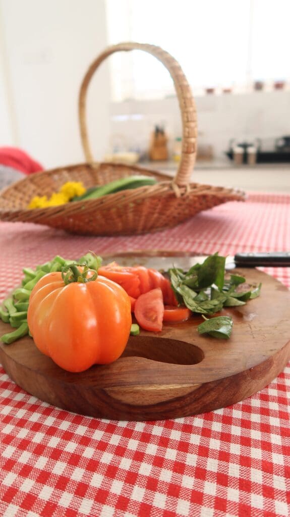 Fresh garden vegetables including tomatoes, spinach, and beans